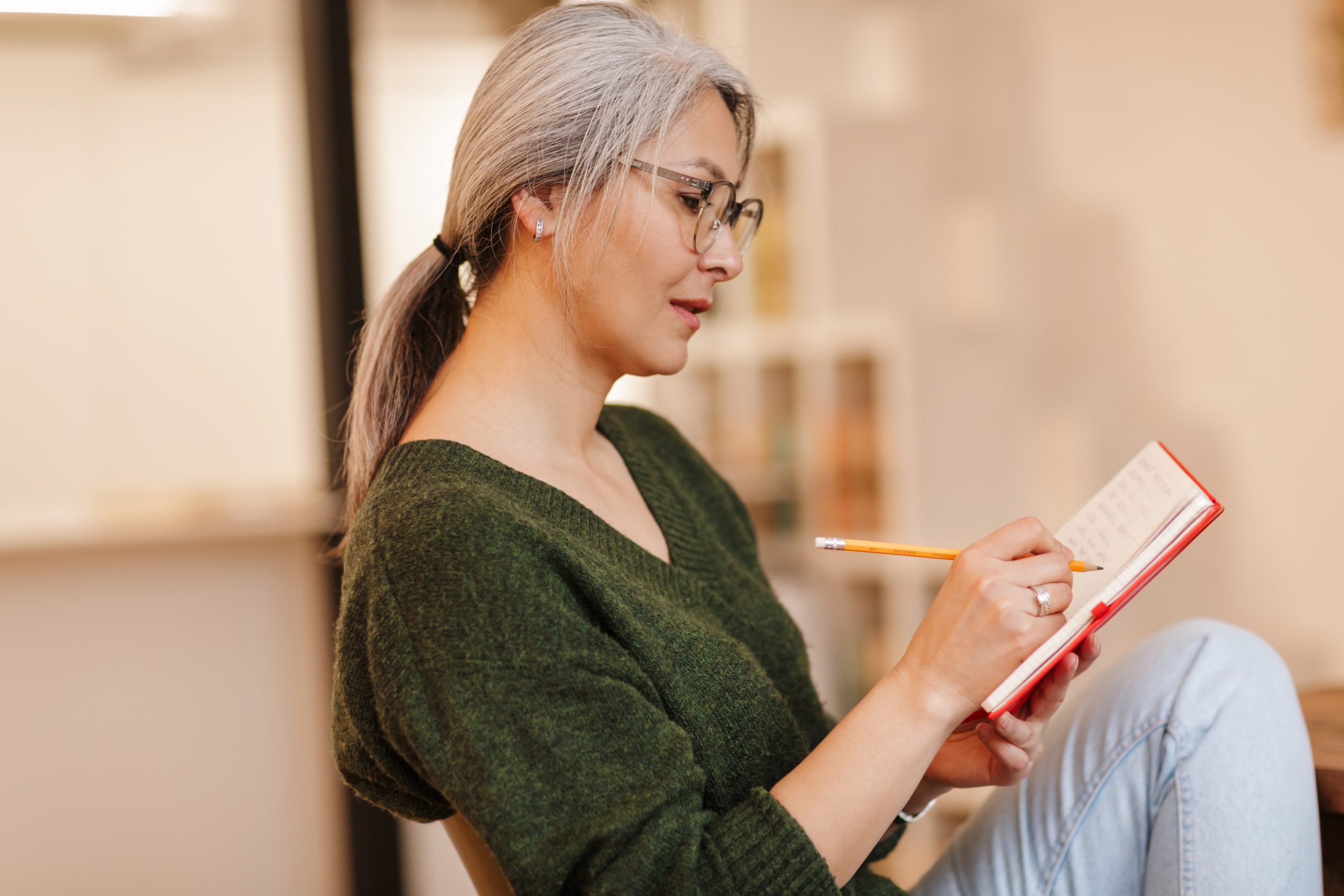 woman writing in journal